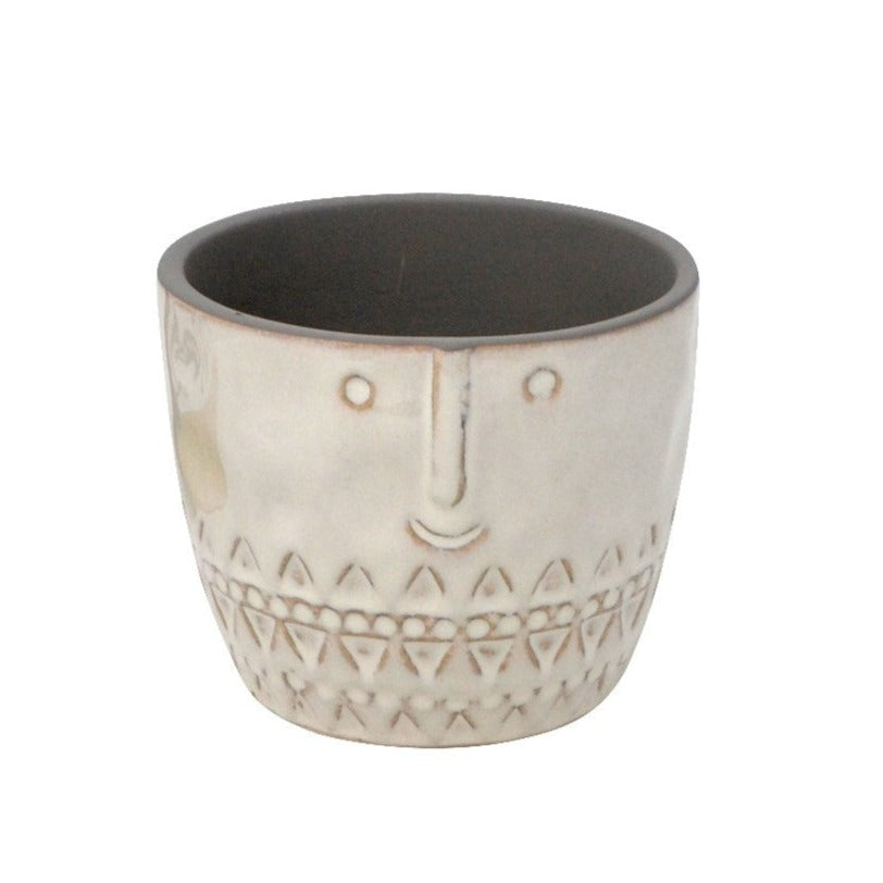 This decorative ceramic pot with padded bottom has a cream coloured exterior with a carved happy face on the top half and and an etched pattern on the lower half.  This pot measures 4" in diameter and is suiable for a 3-3.5" grow/nursery pot.